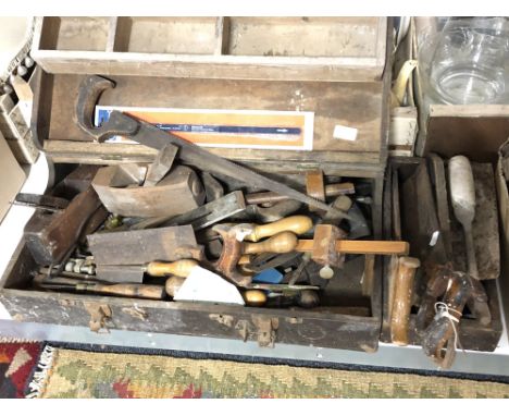 A vintage joiner's tool box and a tool caddy of hand saws, chisels, wood working planes etc 
