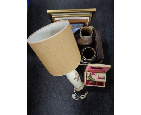 A crate of pictures, pottery jug, beer stein, table lamp with shade and a mid 20th century oriental style jewellery box of co