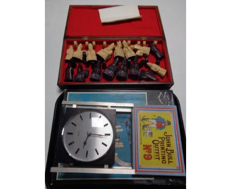 A tray of 20th century Euro Style battery operated mantel clock, a John Bull No. 9 printing outfit, set of wooden cased resin