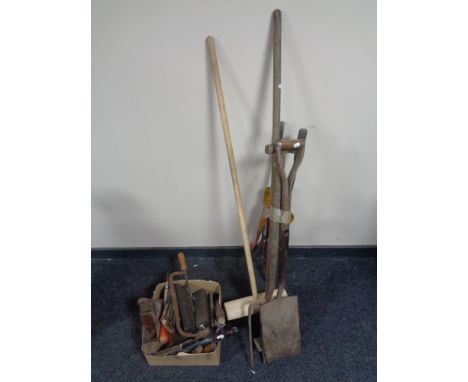 A box of vintage hand tools, chisels, wood working planes, sharpening stones etc and a bundle of garden tools 