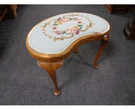 A kidney shaped tapestry upholstered walnut dressing table stool 