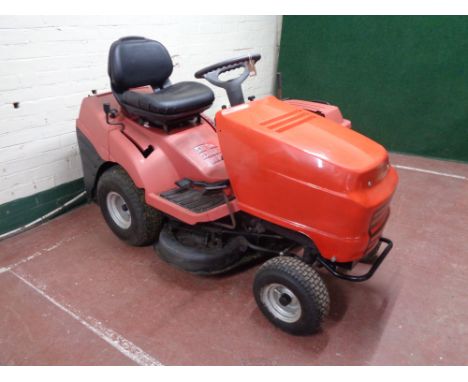 A Honda ride on lawn mower with grass box  CONDITION REPORT: This has a key, the power light turns on when turned but the eng