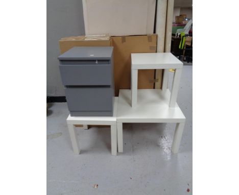 Four boxed Ikea Steffan dining chairs, painted bedside chest, two square lamp tables and a coffee table 