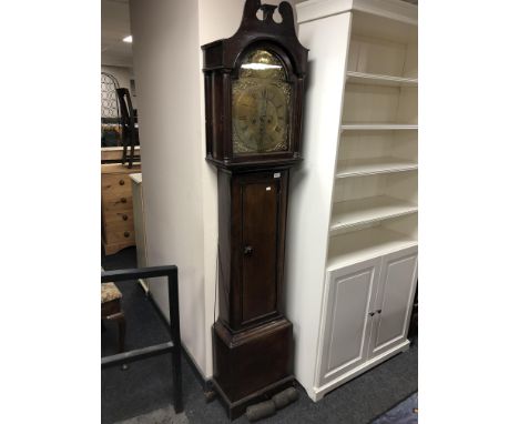 A 19th century oak cased longcase clock with brass dial signed Johnson, Rothbury, with pendulum and weights 