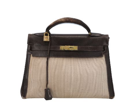 HERMÈS VINTAGE Handtasche "KELLY BAG 32". Koll. 1947. Box Leder und Textil in Dunkelbraun kombiniert mit Canvas in Natur. Mit