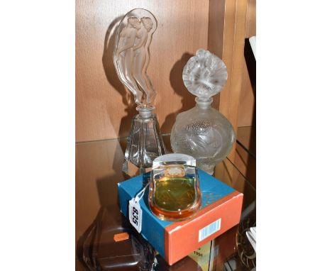 THREE VINTAGE PERFUME BOTTLES comprising a part used Lalique boxed perfume 40ml bottle that comes with a gold coloured miniat
