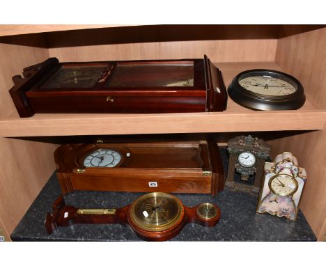 FIVE CLOCKS AND A BAROMETER to include a battery-powered  Collectibles Market 'Garden Whispers' porcelain clock height 23cm, 