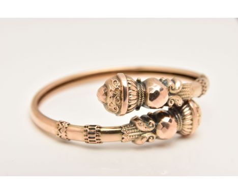 A YELLOW METAL VICTORIAN BANGLE, Etruscan detailed cross over torque bangle, stamped 9ct, approximate internal diameter 55mm,
