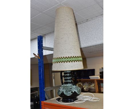 A MID TWENTIETH CENTURY WEST GERMAN POTTERY FLOOR LAMP, with twin handles, green glazes and pierced details, having tall shad