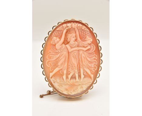 A 9CT GOLD CAMEO BROOCH, of an oval form, carved shell cameo depicting the Three Graces, milgrain collet set within a scallop