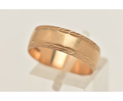 A 9CT GOLD WIDE BAND RING, polished and textured design, approximate band width 6.7mm, hallmarked 9ct London, ring size Q, ap