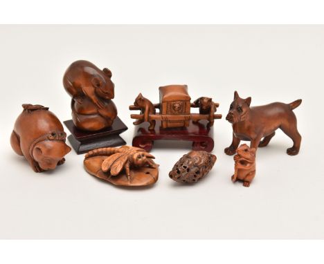 AN ASSORTMENT OF NETSUKE, seven carved netsuke, depicting a mouse on a bird, a dog and butterfly, a mouse, a standing dog, a 