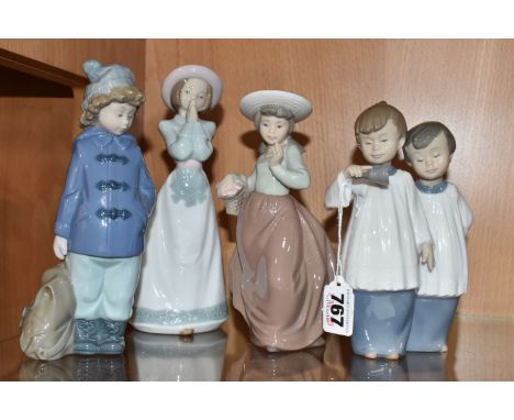 FOUR NAO FIGURES, comprising a figure group of two altar boys, a girl with a basket of flowers, a child in a duffel coat with