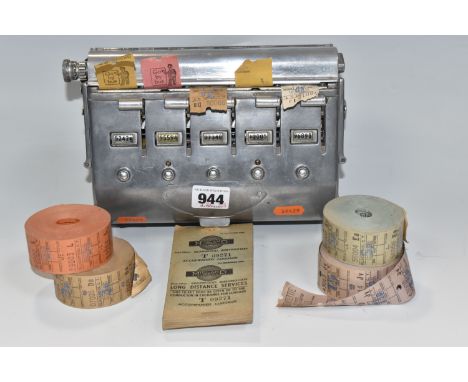 A BUS CONDUCTOR'S TICKET MACHINE loaded with four ticket rolls, four loose rolls for Newport and Blackpool transport departme