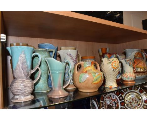 A GROUP OF MOSTLY ART DECO WADE HEATH JUGS AND VASES to include a Wade Heath 'Galleon Jug' height 20cm, a 'Gothic' patterned 