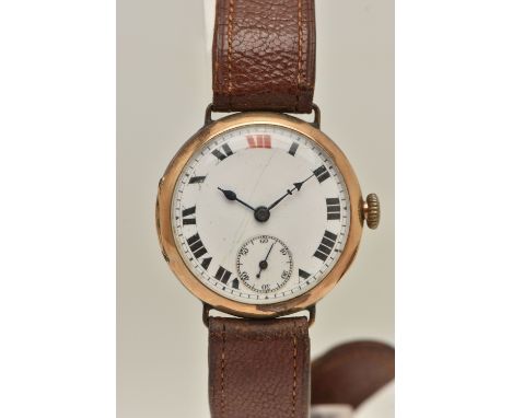 AN EARLY 20TH CENTURY 9CT GOLD TRENCH WRISTWATCH, manual wind, round white dial, Roman numerals, subsidiary dial at the six o