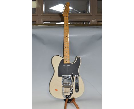 A 2004 FENDER TELECASTER ELECTRIC GUITAR, crafted in Japan, with blonde finish, maple neck, two single coil pick-ups and Fend