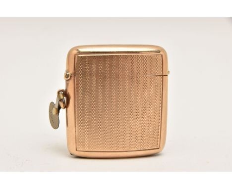 AN EARLY 20TH CENTURY, 9CT GOLD VESTA CASE, rounded square form with engine turned pattern, striker to the base, fitted with 