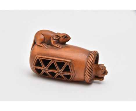 A NETSUKE, carved wood depicting a mouse on top of a container with a cat that moves in and out, approximate length 43mm, sig