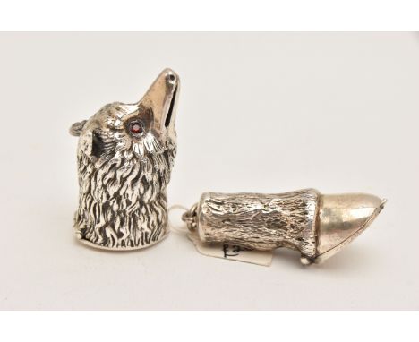 TWO WHITE METAL NOVELTY VESTA CASES, the first in the form of a wolf head set with red paste eyes, hinged cover to the neck, 