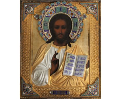 A Russian icon of Christ Pantocrator in a gilded silver and cloisonné enamel oklad, with enamelled text and floral decoration