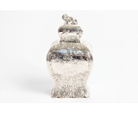 A late Victorian small silver tea caddy with lion finial and embossed cherubs to lid and figures to shaped body with addition