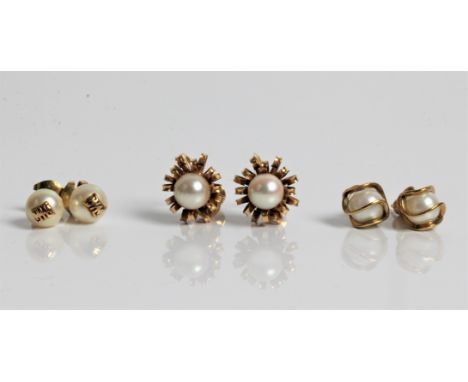 Two pairs of pearl set earrings, both marked 14ct gold with another pair of pearl style earrings. Important: Online viewing a