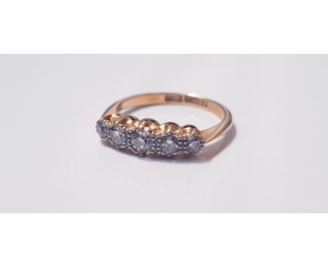 A yellow gold ring, of five diamonds,total approx. 0.35 cts, marked 18ct, ring size L, approx. weight 2.4gms. Important: Onli