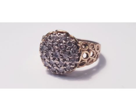 A yellow gold18ct diamond cluster ring of domed form set with 19 small diamonds, ring size R, approx.weight 6gms. Online view