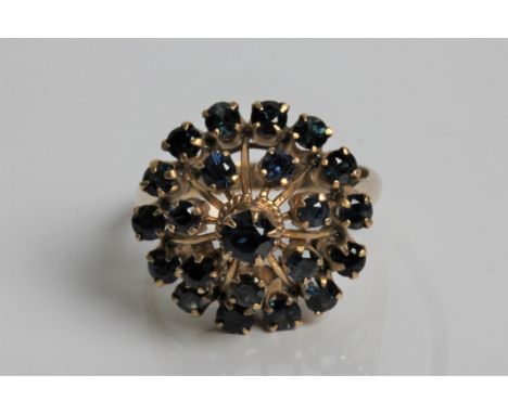 A tiered sapphire ring marked 18ct gold, ring size M, approx. weight 3.9gms. Important: Online viewing and bidding only. No i