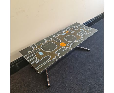 A mid century Belgian tile top coffee table designed by Adri Belarti, 121cm x 46cm x 41cm. IMPORTANT: Online viewing and bidd