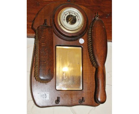 Oak wall hanging barometer with two brushes and mirror all attached to oak board