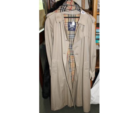 Beige  overcoat labelled Burberry and a Burberry scarf