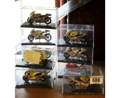 Ten boxed scale model motorcycles