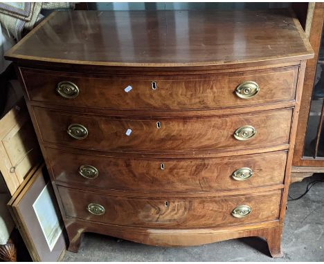 A George III mahogany bow fronted chest of four long graduating drawers 93 H x 95.5 WLocation: R ConIf there is no condition 