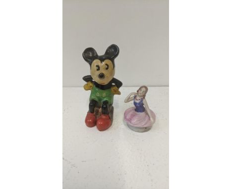 A 1930's/40's pottery example of Mickey Mouse together with a porcelain half doll tea cosyLocation:If there is no condition r