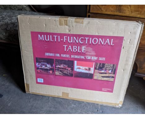 A boxed folding trestle table Location: R ConIf there is no condition report shown, please request