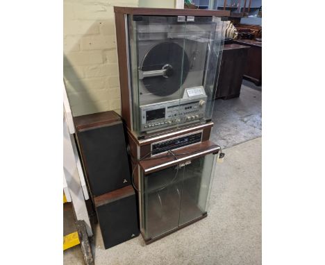 A Mitsubishi MC-8000 upright turntable in a standing hi-fi unit with a Memorex CP-2300P Compact disc digital audio player 143