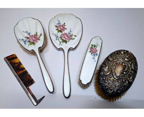 A 3-piece silver and white enamel guilloche dressing table set, a white metal backed clothes brush and comb A/F. Location:Con