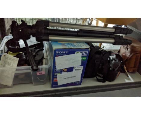 A selection of film and digital cameras and associated equipment, along with a leather cased Zenith 10x50 field glasses, and 