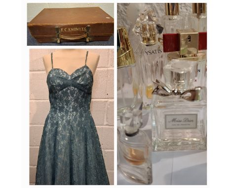 A mixed lot comprising empty scent bottles, jewellery, an Oriental parasol, a vintage Revelations suitcase including bead nec