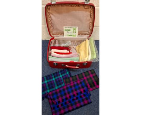 A red Retro Antler weekend suitcase and contents to include vintage cashmere scarves and 3 Viyella tartan scarves. Location:R