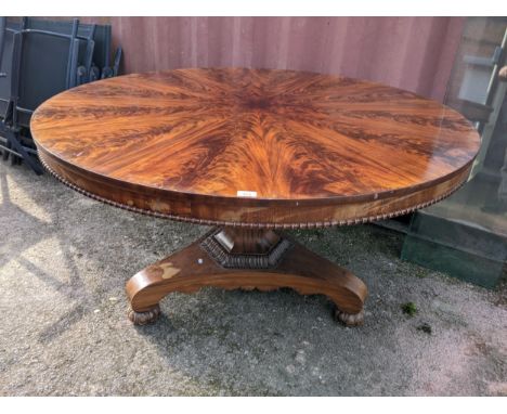 A 19th century flame mahogany breakfast table having a beaded rim and on a tripod base, 75cm h x 137cm wLocation:If there is 