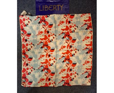 Liberty- A 1980's un-used silk scarf with original tags having a cream, salmon pink, pale blue and black abstract foliage des
