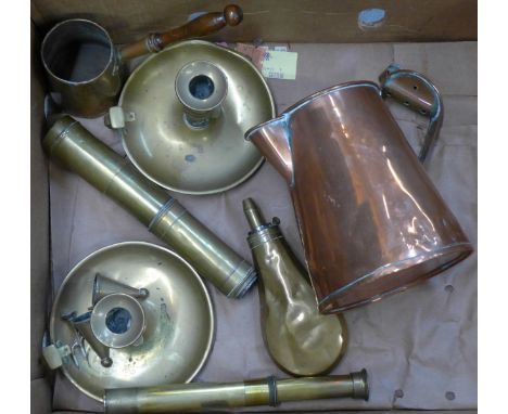 A box of metalware, including copper jug and chamber stick