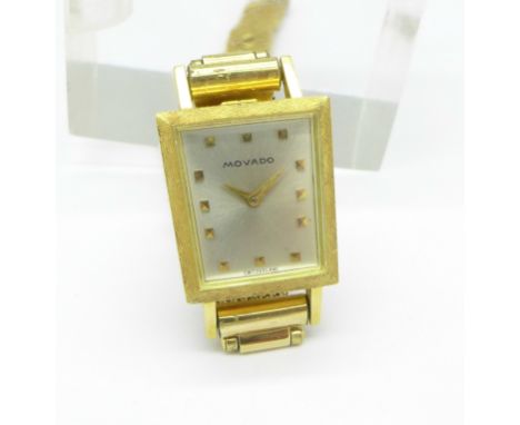 An 18ct gold Movado lady's wristwatch with back wind on a gold plated strap