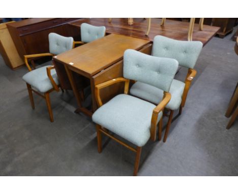 A light oak drop-leaf table and four chairs 