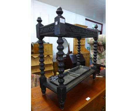 A carved oak stick stand 