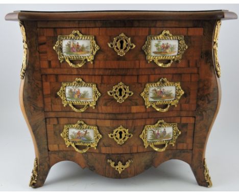 A Louis XVI design kingwood banded figured walnut serpentine front  miniature commode fitted 3 gilt metal mounted drawers wit