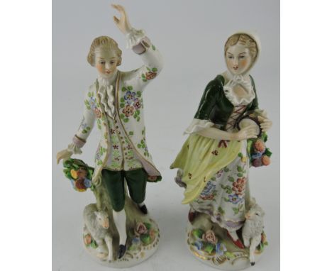 A pair of German ceramic shepherd and shepherdess figures